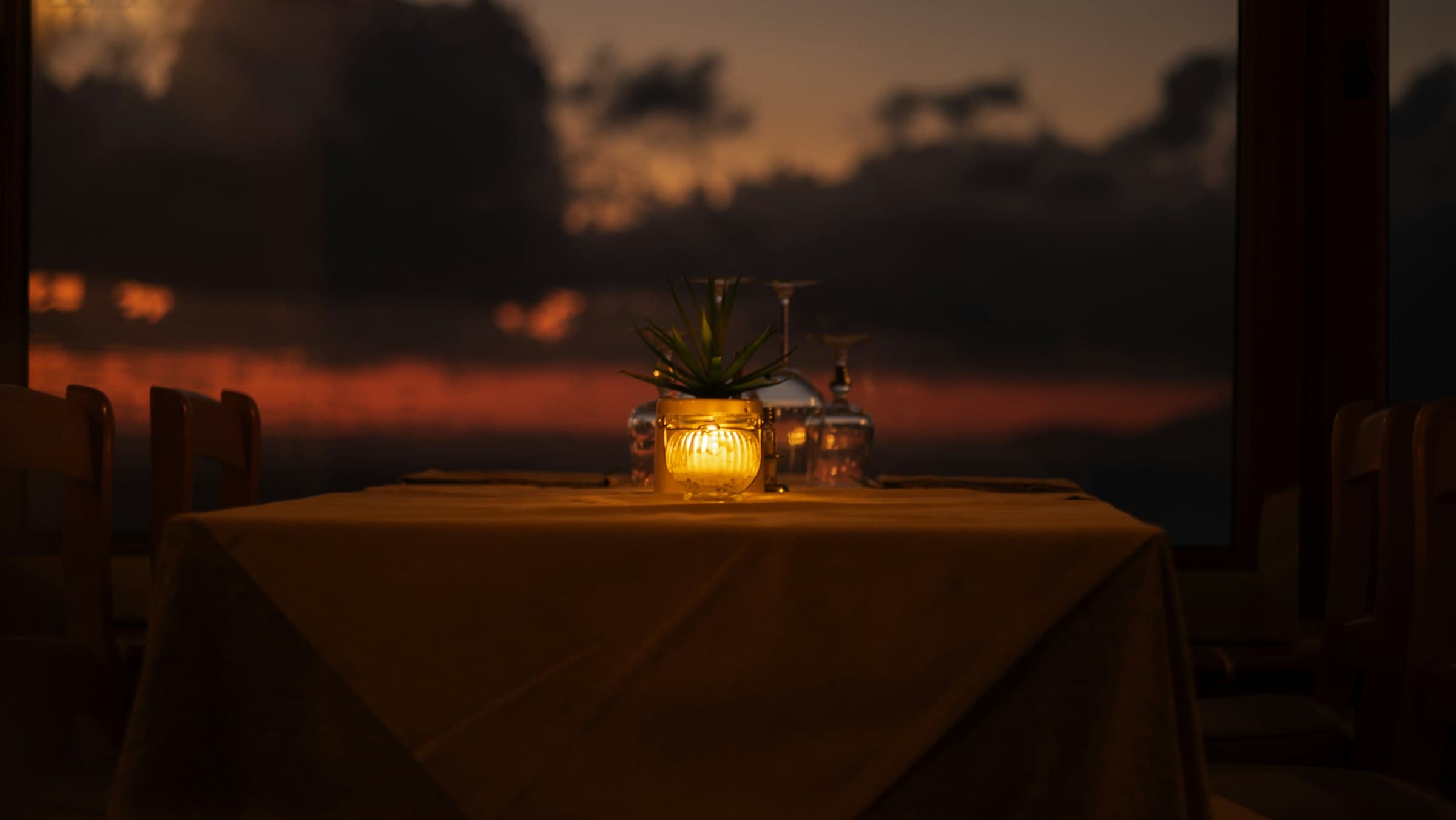 A candlelit dinner for two by the sea
